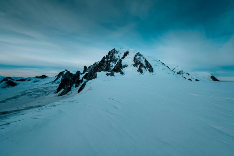 Breathtaking scene of snow-covered mountains and icy landscape in Haute-Savoie, France.